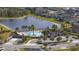 Aerial view of the community pool, lake and recreation area at 10012 Lovegrass Ln, Orlando, FL 32832