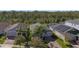 Aerial view of homes with well-manicured lawns and paved driveways at 10012 Lovegrass Ln, Orlando, FL 32832