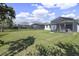 Large grassy backyard with multiple screened patios, perfect for Gathering fun at 10012 Lovegrass Ln, Orlando, FL 32832