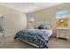 Bright bedroom with carpeted floors features lots of natural light and modern furniture at 10012 Lovegrass Ln, Orlando, FL 32832