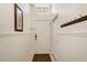 Bright foyer featuring a coat rack, neutral walls and a window above the front door at 1025 Sandy Ridge Dr, Davenport, FL 33896