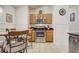 Stainless steel appliances, wood cabinets and granite counters in this well-equipped kitchen at 1025 Sandy Ridge Dr, Davenport, FL 33896