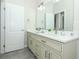 A spacious bathroom featuring double sinks and modern fixtures at 1038 Dennis Ave, Orlando, FL 32807