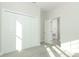 A bedroom with a closet and bright lighting at 1038 Dennis Ave, Orlando, FL 32807