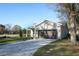 Charming home with stone facade, driveway pavers, and manicured lawn at 1038 Dennis Ave, Orlando, FL 32807