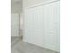 A hallway with a large closet with folding doors at 1038 Dennis Ave, Orlando, FL 32807