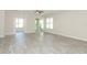 Spacious living room features tile flooring, glass windows, and modern finishes at 1038 Dennis Ave, Orlando, FL 32807