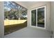 An outdoor patio offers a view of a well-maintained lawn and wooden fence at 1038 Dennis Ave, Orlando, FL 32807