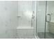 Walk-in shower with bench, large format tile, and glass enclosure at 1038 Dennis Ave, Orlando, FL 32807