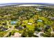 Aerial view of the neighborhood featuring multiple tennis courts and a private lake at 11234 Willow Gardens Dr, Windermere, FL 34786