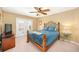 Bedroom with a metal bed frame and a pair of french doors at 11234 Willow Gardens Dr, Windermere, FL 34786