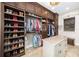 Large walk-in closet with custom built-in shelving, a center island and plenty of storage space at 11234 Willow Gardens Dr, Windermere, FL 34786