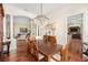 Elegant dining room featuring a chandelier, hardwood floors, stylish furniture, and an open layout at 11234 Willow Gardens Dr, Windermere, FL 34786