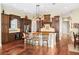 Spacious open eat-in kitchen featuring granite counters, a center island and stainless steel appliances at 11234 Willow Gardens Dr, Windermere, FL 34786