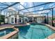 Backyard pool and spa area featuring an expansive patio for entertaining at 11234 Willow Gardens Dr, Windermere, FL 34786