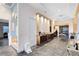 Elegant foyer with wine storage, statement lighting, and gray marble flooring at 13319 Alderley Dr, Orlando, FL 32832