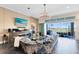 Bright living room featuring plush sofa, tile flooring, and a fireplace with built-in wine storage at 13319 Alderley Dr, Orlando, FL 32832