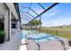 Pool and jacuzzi overlooking the golf course with outdoor seating at 13319 Alderley Dr, Orlando, FL 32832