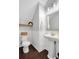 Cozy powder room featuring a pedestal sink and charming decor at 13864 Sachs Ave, Orlando, FL 32827