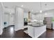 Modern kitchen featuring white cabinetry, stainless steel appliances, and a center island at 13864 Sachs Ave, Orlando, FL 32827