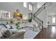 Bright and airy living room featuring a staircase and open layout at 13864 Sachs Ave, Orlando, FL 32827