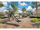 Community playground with slide and swings located within a well maintained residential neighborhood with mature landscaping at 13864 Sachs Ave, Orlando, FL 32827