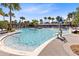 Leisurely community pool features lush landscaping, zero-depth entry, and a water play area at 13875 Sachs Ave, Orlando, FL 32827