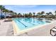 Large community pool features lane dividers, ample seating, and well-maintained landscaping at 13875 Sachs Ave, Orlando, FL 32827