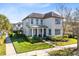 Charming two-story home with lush landscaping, inviting walkway and covered entryway at 13875 Sachs Ave, Orlando, FL 32827