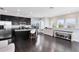 Modern kitchen featuring black cabinetry, stainless steel appliances, and hardwood floors at 13875 Sachs Ave, Orlando, FL 32827