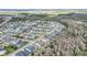 Aerial view of a residential community with a marker on a home highlighting its prime location near natural surroundings at 14150 Aldford Dr, Winter Garden, FL 34787