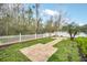 Serene backyard with brick pathway, lawn and privacy fencing at 14150 Aldford Dr, Winter Garden, FL 34787