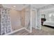 Modern bathroom featuring a shower with decorative marble-patterned walls, a white shower curtain, and updated fixtures at 14150 Aldford Dr, Winter Garden, FL 34787