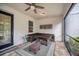 Relaxing screened-in patio with wicker furniture, a ceiling fan, and a view of the backyard at 14150 Aldford Dr, Winter Garden, FL 34787