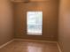 Clean, neutral bedroom with tile floor and window offering natural light at 145 Reserve Cir # 113, Oviedo, FL 32765