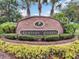 Hunter's Reserve community sign framed by foliage and palm trees at 145 Reserve Cir # 113, Oviedo, FL 32765