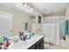 Bathroom with dual sinks, a shower-tub combo, and modern fixtures at 1700 Leatherback Ln, St Cloud, FL 34771