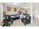 Inviting living room with tile flooring, neutral walls, and an arched opening to the dining area at 1700 Leatherback Ln, St Cloud, FL 34771