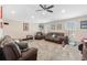 Spacious living room with comfortable seating and a ceiling fan at 1700 Leatherback Ln, St Cloud, FL 34771