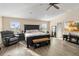 Spacious main bedroom featuring a ceiling fan, walk-in closet, and ample natural light at 1700 Leatherback Ln, St Cloud, FL 34771