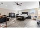 Spacious main bedroom featuring a ceiling fan, walk-in closet, and ample natural light at 1700 Leatherback Ln, St Cloud, FL 34771