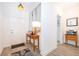 Bright entryway featuring wood-look tile flooring, a console table, and decorative mirrors, creating a welcoming space at 1920 Perch Hammock Loop, Groveland, FL 34736