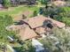 Aerial view of a landscaped property with a patio and well-maintained roof in a residential neighborhood at 193 Heron Bay Cir # 8, Lake Mary, FL 32746