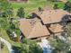 Aerial view of a landscaped property with a patio and well-maintained roof in a residential neighborhood at 193 Heron Bay Cir # 8, Lake Mary, FL 32746