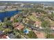 This aerial view showcases a lakeside community, complete with a shared pool and lush landscaping at 193 Heron Bay Cir # 8, Lake Mary, FL 32746