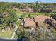 Aerial view of a landscaped property with a patio in a residential neighborhood at 193 Heron Bay Cir # 8, Lake Mary, FL 32746