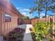 The house's backyard features a sidewalk with manicured landscaping at 193 Heron Bay Cir # 8, Lake Mary, FL 32746