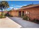 The home's exterior showcases a brick accent wall and a driveway complemented by lush landscaping at 193 Heron Bay Cir # 8, Lake Mary, FL 32746