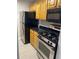 The kitchen features stainless steel appliances, including a range, microwave and refrigerator at 2025 Dixie Belle Dr # 2025 B, Orlando, FL 32812