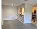 The living room area, showing light-colored walls and floors, with a pass-through to the kitchen at 2025 Dixie Belle Dr # 2025 B, Orlando, FL 32812